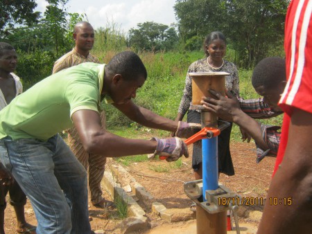 Community members working around a borehole rehabilitation documented by NIWA